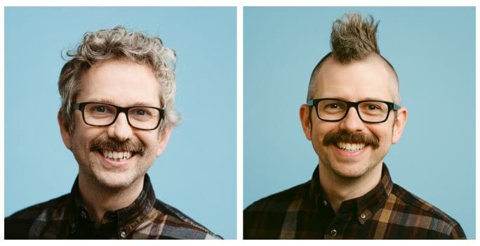 Side-by-side portraits of the same smiling man against a light blue background. In the left image, a real photo, he has curly grey hair and a thick moustache, wearing dark rectangular glasses and a plaid shirt. In the right image, which is AI generated, he has a dramatic mohawk hairstyle with the sides of his head shaved, the same moustache and glasses, and is also wearing a similar plaid shirt - however his facial features are slightly different, and his teeth are straighter.
